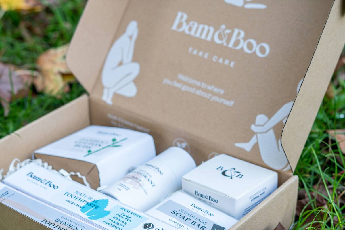 Close-up of oak essential body balm jar with natural ingredients visible